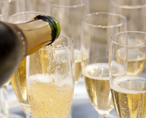 9450391 - champaign being pored into glasses.